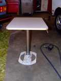 Table with its optional outdoor stand
