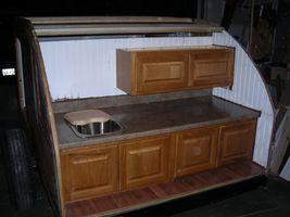upper cabinet installed,sink in beadboard calked