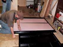 Fitting floor insulation to underside