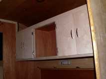 Doors hung on cabin cabinets