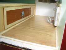 Hardwood flooring and clothes drawer installed