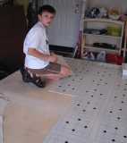 Our father-son project; laying vinyl tile squares