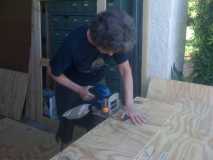 Kathy cutting biscuit slots in floor.