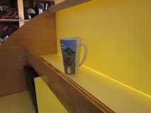Mug in galley top shelf
