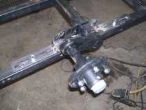 Axle bolted to frame
